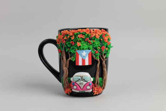 Decorative mug with a car and flag design on a wooden surface outdoors.